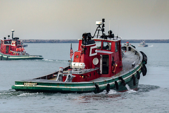 Tugs Off To Work